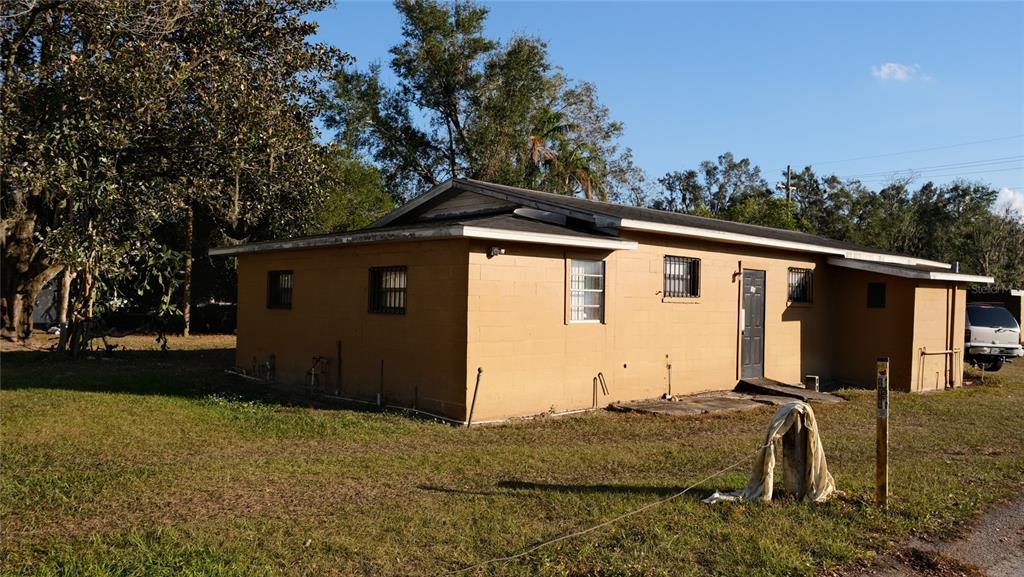 34 4th Street Southwest Fort Meade, FL 33841 - Photo 28 of 31 a side view of a house with backyard