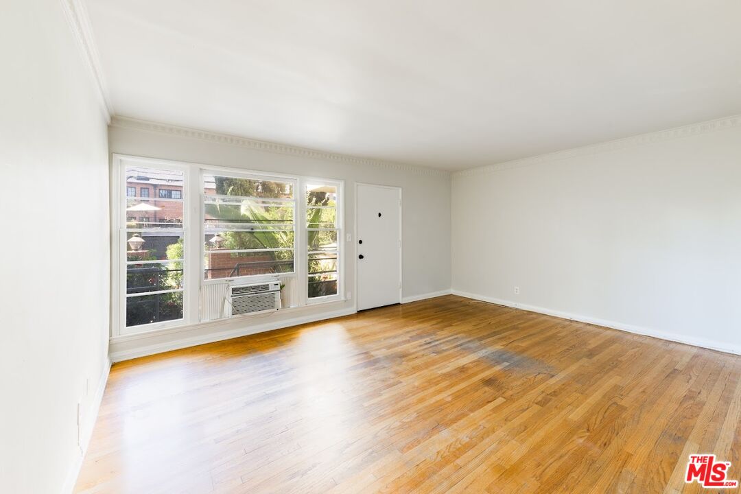 1706 North Stanley Avenue, Unit 2 Los Angeles, CA 90046 - Photo 2 of 10 a view of an empty room with a window