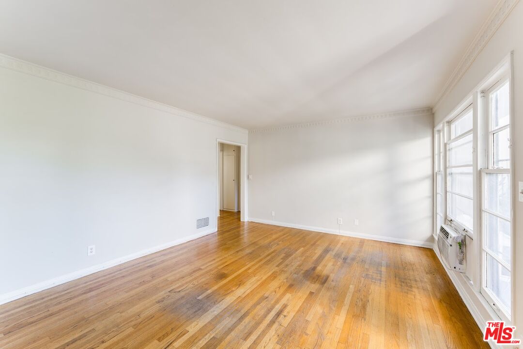 1706 North Stanley Avenue, Unit 2 Los Angeles, CA 90046 - Photo 4 of 10 a view of empty room with wooden floor and fan
