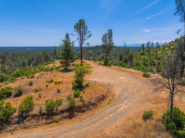 a view of a road with a building in the background