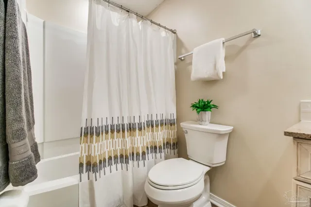 a bathroom with a toilet and a sink