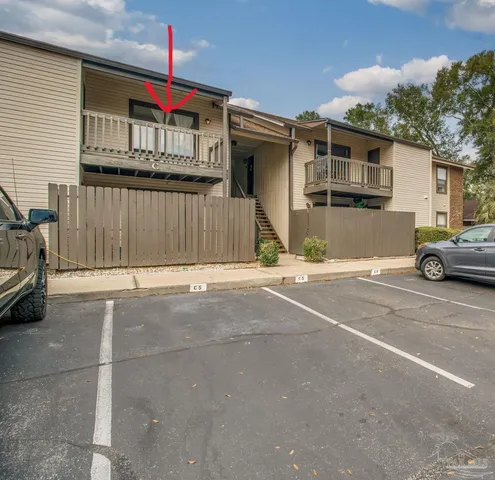 a view of a car park in front of house