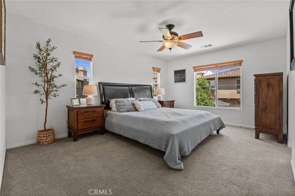 28356 Santa Rosa Lane Saugus, CA 91350 - Photo 11 of 50 a bedroom with a bed and a chandelier