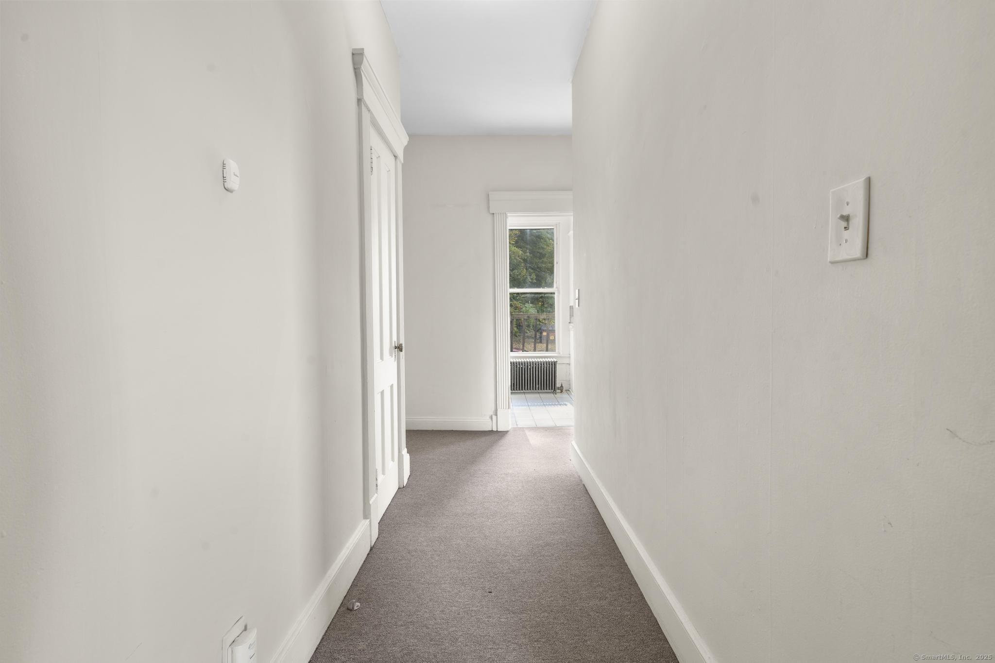 113 East Main Street, Unit 5 Meriden, CT 06450 - Photo 16 of 21 a view of a hallway with wooden floor