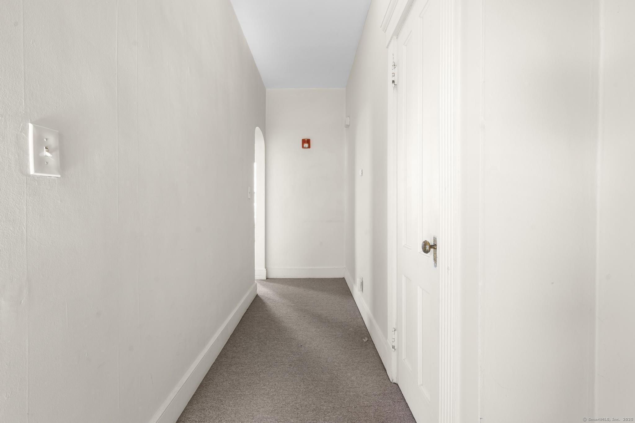 113 East Main Street, Unit 5 Meriden, CT 06450 - Photo 17 of 21 a view of a hallway with wooden floor