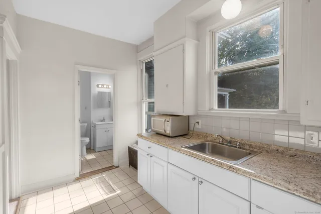 a kitchen with a sink and a window