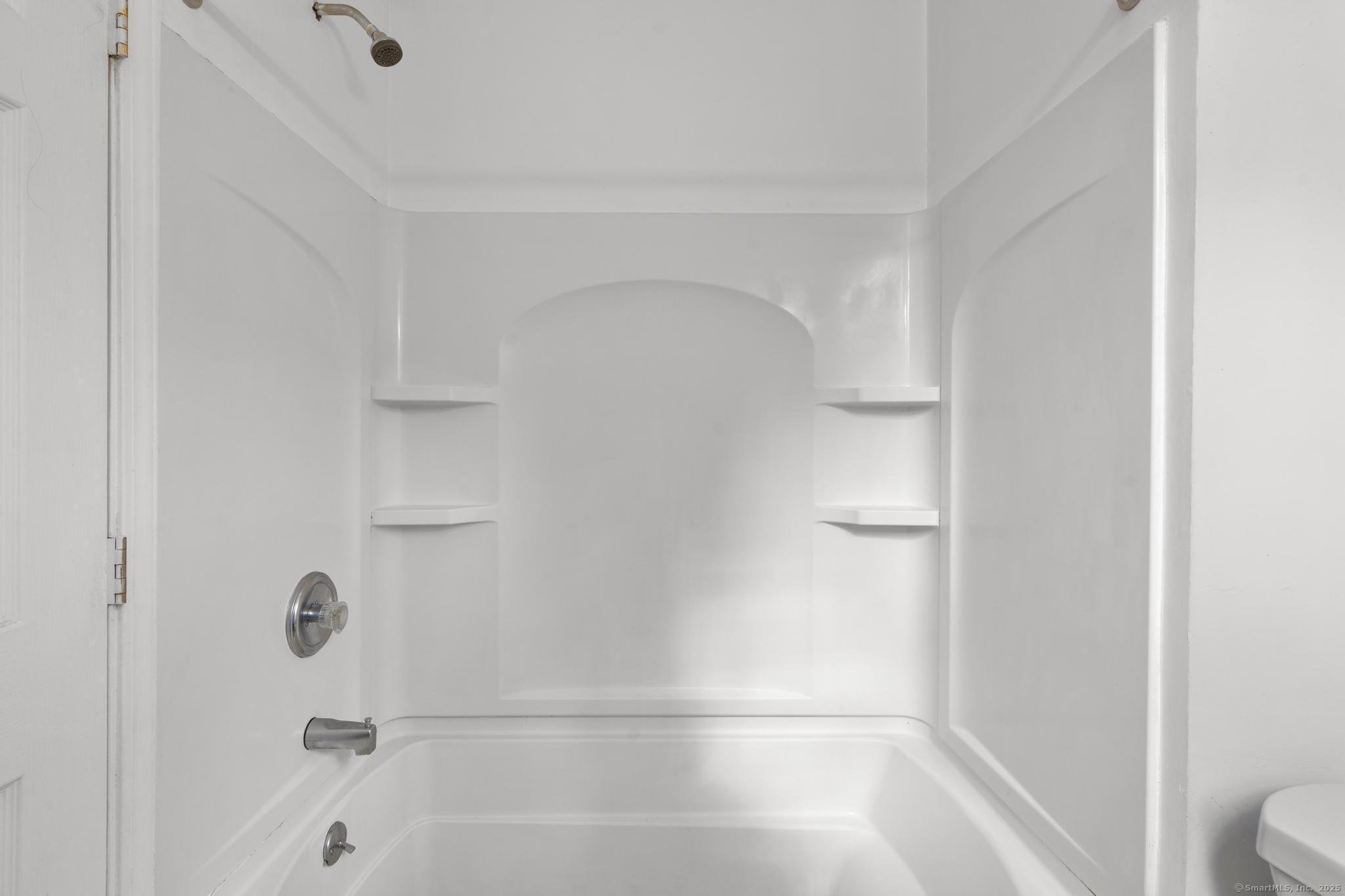 113 East Main Street, Unit 5 Meriden, CT 06450 - Photo 9 of 21 a bathroom with a bathtub