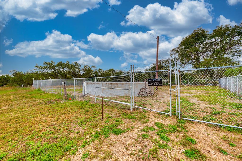 2617 Fm 2035, Unit A Sweetwater, TX 79556 - Photo 33 of 33 View of yard featuring a gate and fence