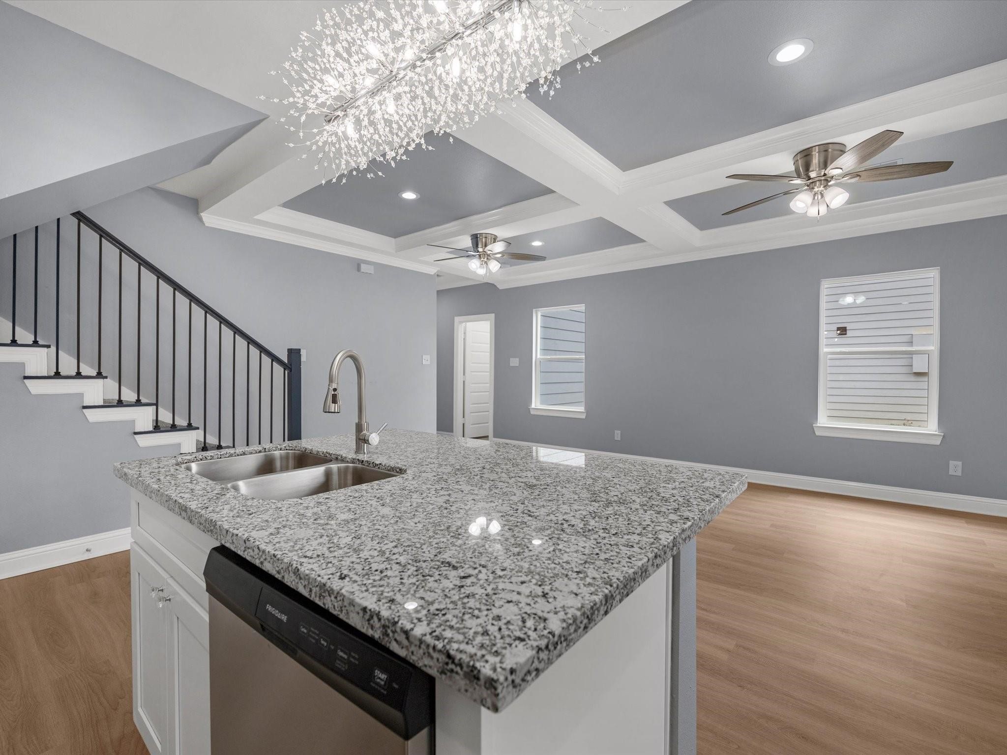 3528 South Street Brookshire, TX 77423 - Photo 7 of 18 a kitchen with center island chandelier and living room view