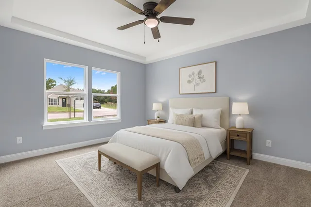 a bedroom with a bed and window