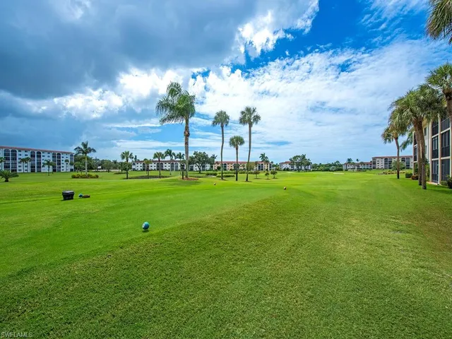 a view of a golf course with a lake