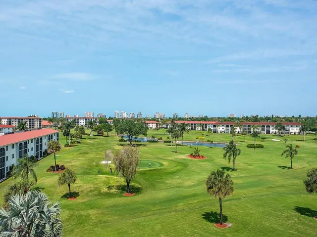 a view of a golf course with a lake
