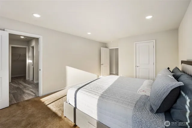 a bedroom with a bed and a walk in closet