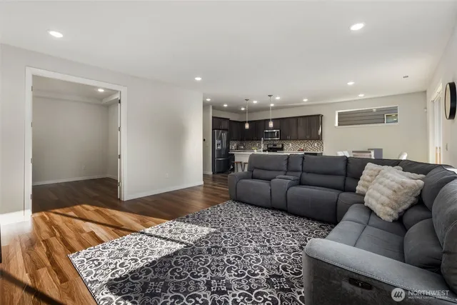a living room with a couch and a rug