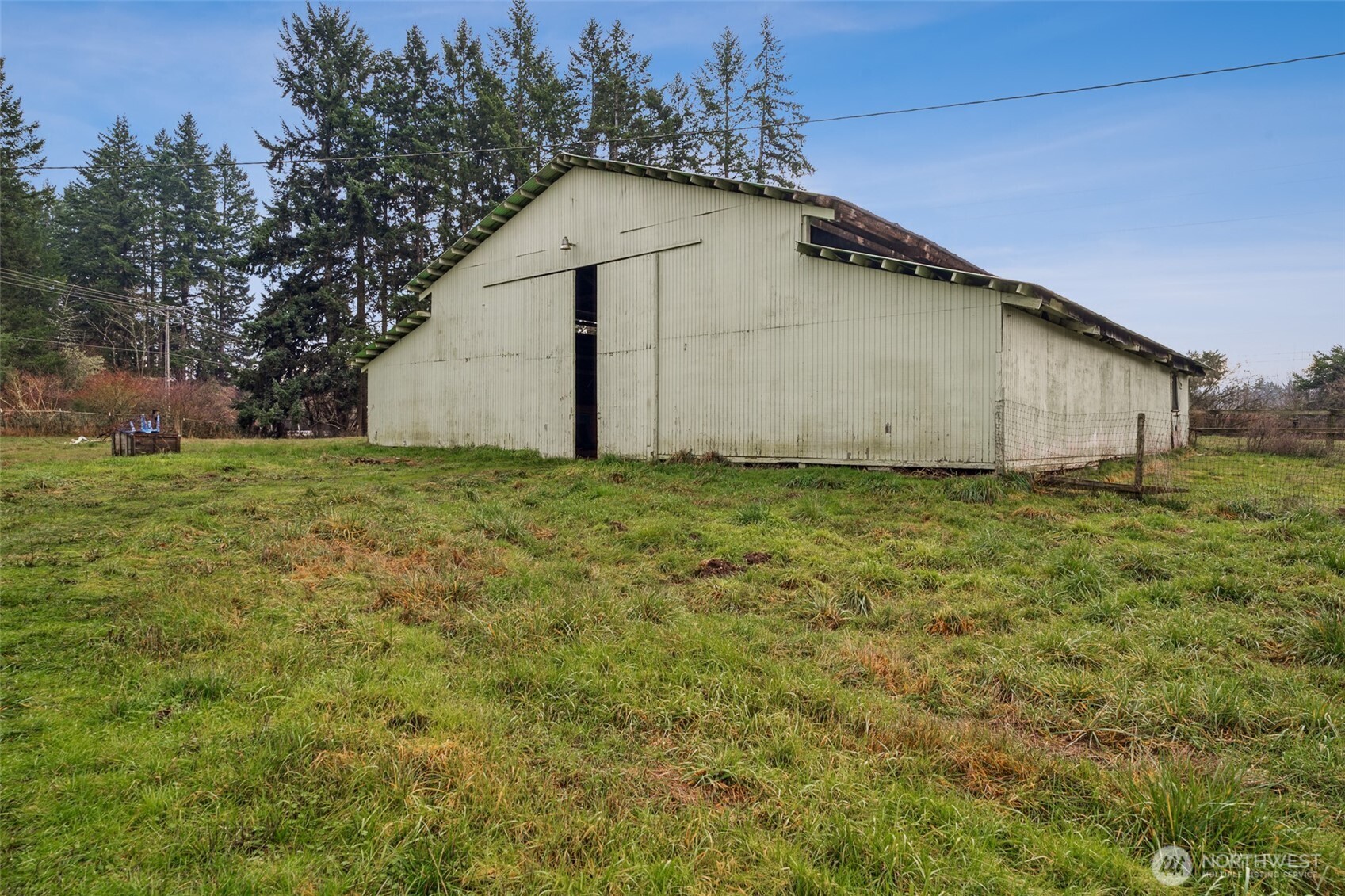 35120 Kinsman Road East Roy, WA 98580 - Photo 20 of 40 a house with green field in front of it