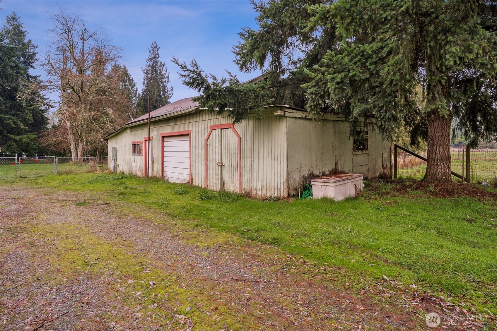 35120 Kinsman Road East Roy, WA 98580 - Photo 30 of 40 a white house that has tree in front of it