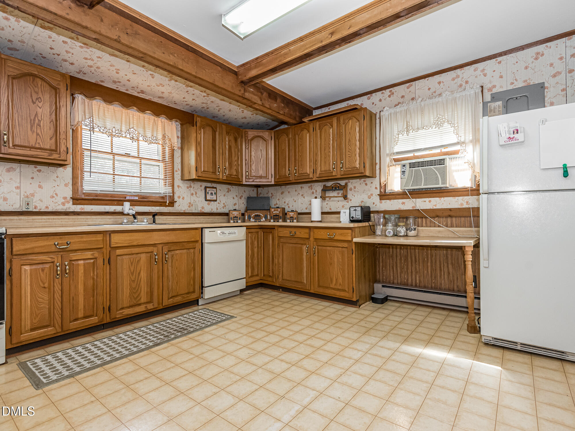 381 Royal Road Roseboro, NC 28382 - Photo 9 of 30 a kitchen with a sink a window and cabinets