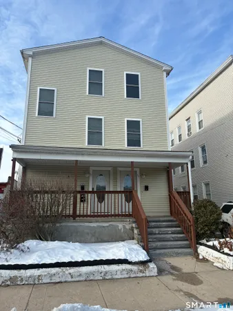 a front view of a house with a stairs