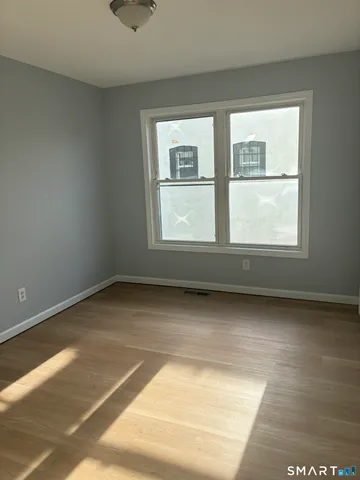 a view of an empty room with a window
