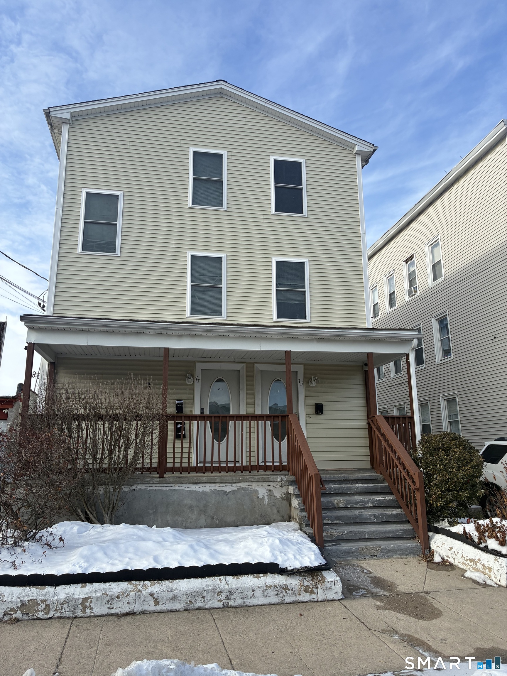 75 Ash Street Bridgeport, CT 06605 - Photo 9 of 9 a front view of a house with a stairs