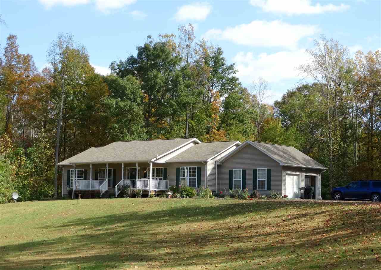 894 Race Ground Road Rochelle, VA 22738 - Photo 1 of 19 a front view of a house with a garden