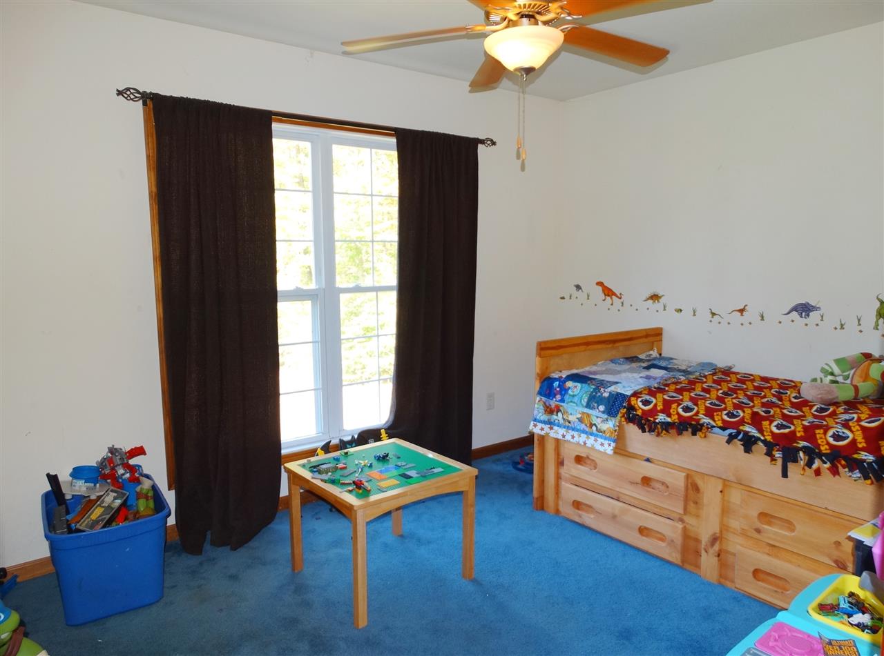 894 Race Ground Road Rochelle, VA 22738 - Photo 14 of 19 a living room filled with furniture and a table