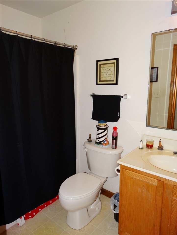 894 Race Ground Road Rochelle, VA 22738 - Photo 15 of 19 a white toilet sitting next to a bathroom sink