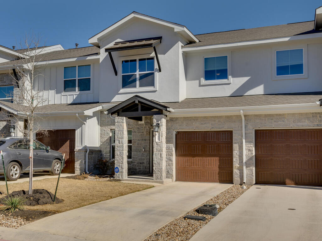 2257 Local Rebel Loop Leander, TX 78641 - Photo 1 of 26 a front view of a house with a yard and garage