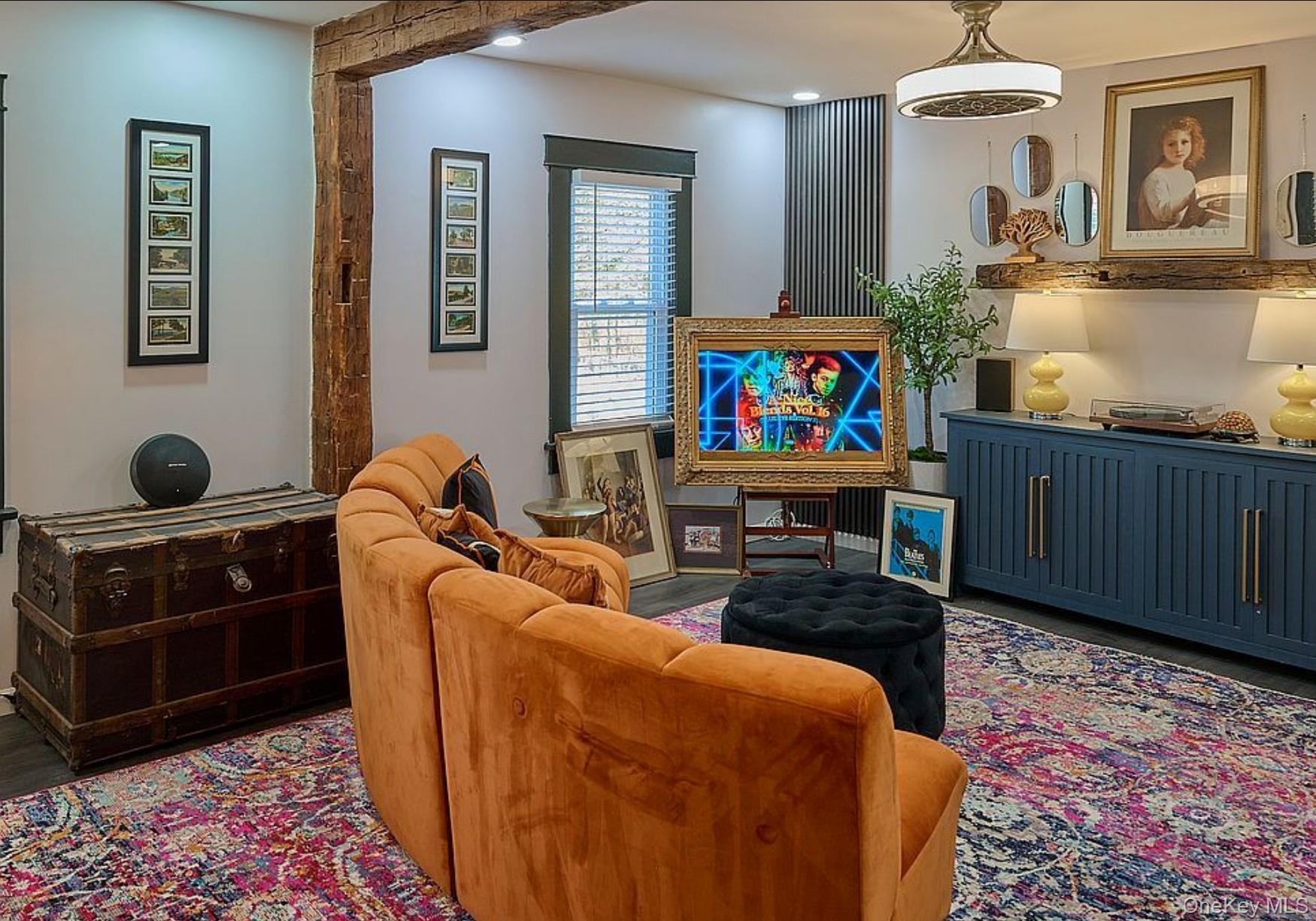 541 Cold Spring Road Monticello, NY 12701 - Photo 7 of 31 a living room with furniture a rug and a chandelier