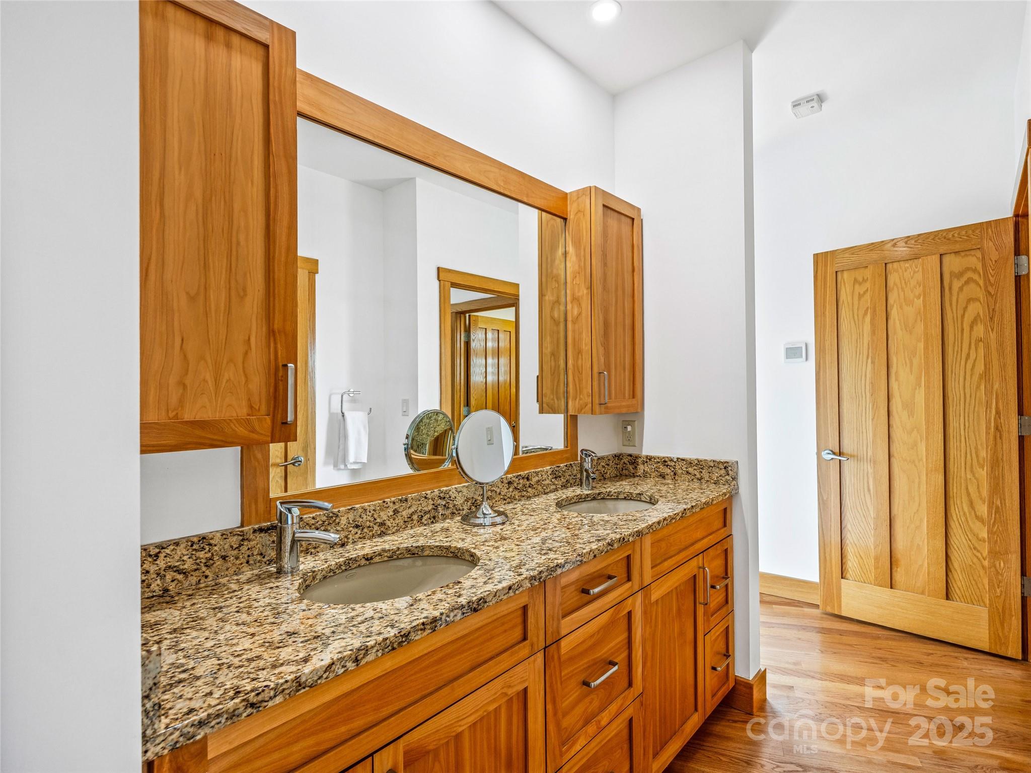 136 Senator Reynolds Road Asheville, NC 28804 - Photo 28 of 48 a bathroom with a granite countertop sink and a mirror