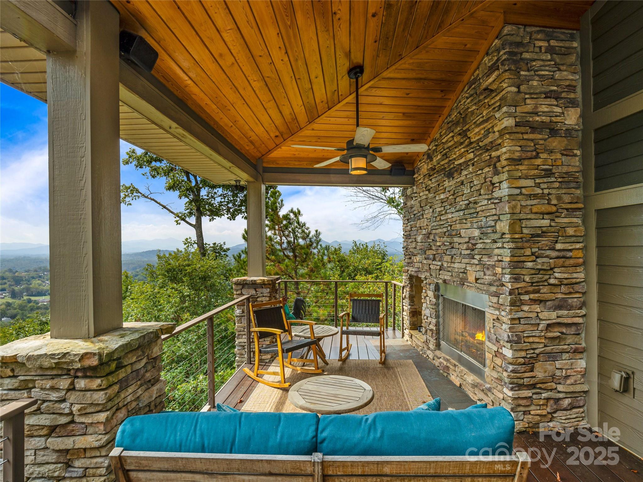 136 Senator Reynolds Road Asheville, NC 28804 - Photo 34 of 48 a view of a balcony with chair and wooden floor