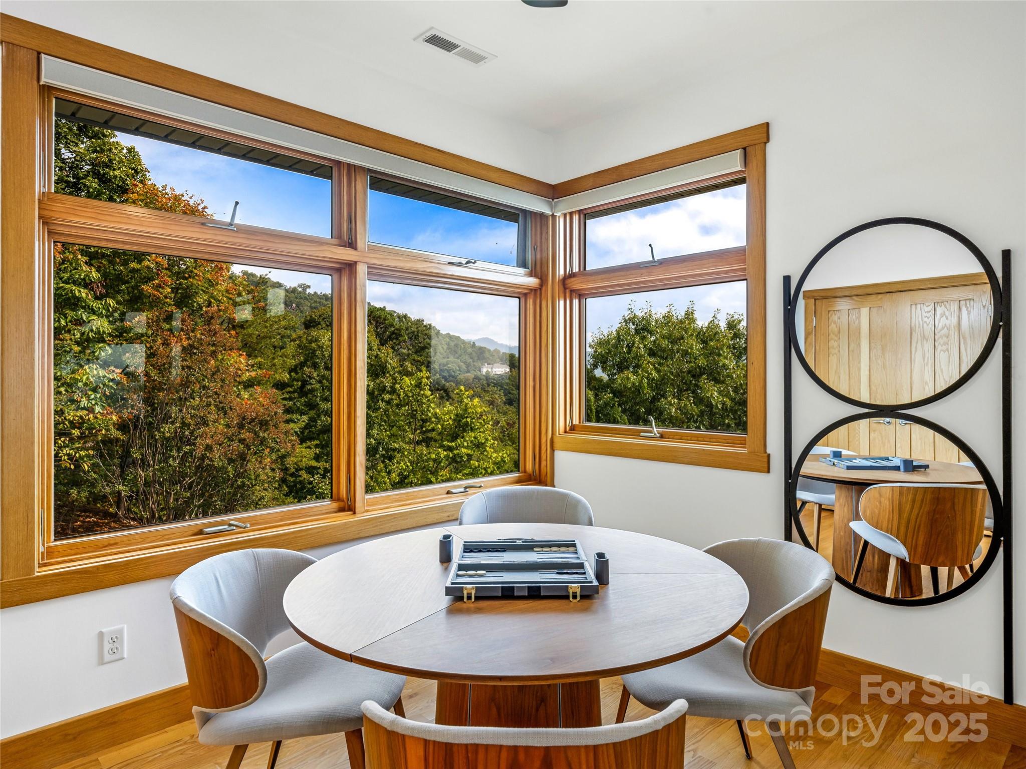 136 Senator Reynolds Road Asheville, NC 28804 - Photo 37 of 48 a dining room with furniture and a window