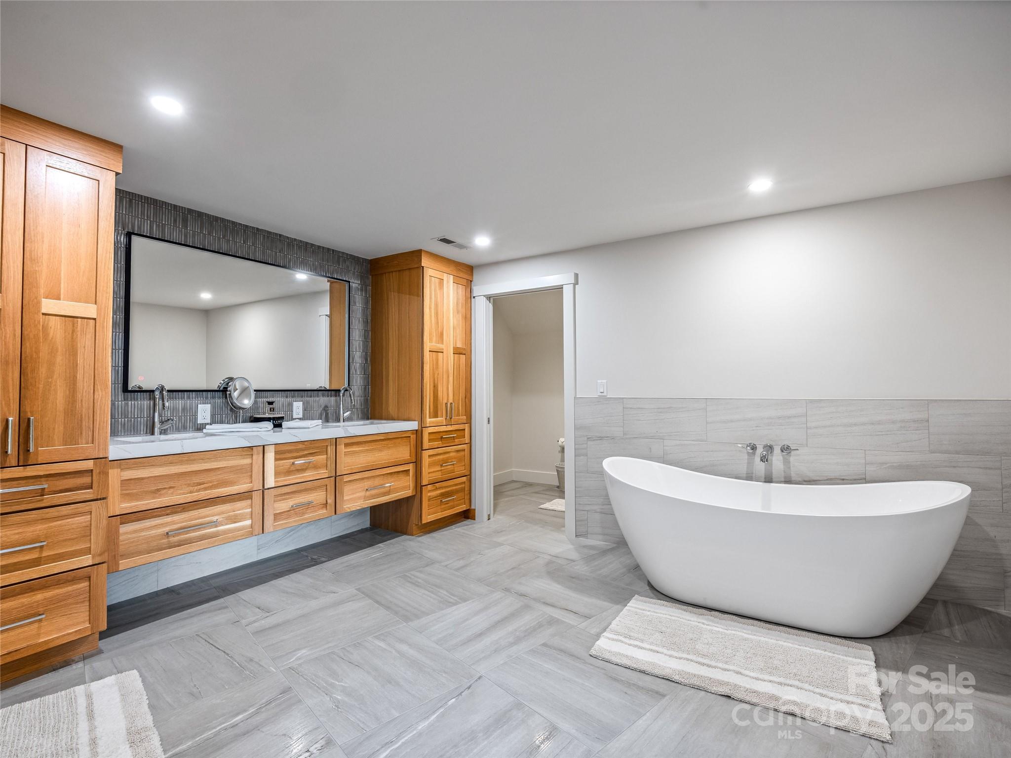 136 Senator Reynolds Road Asheville, NC 28804 - Photo 43 of 48 a bathroom with a bathtub and mirror
