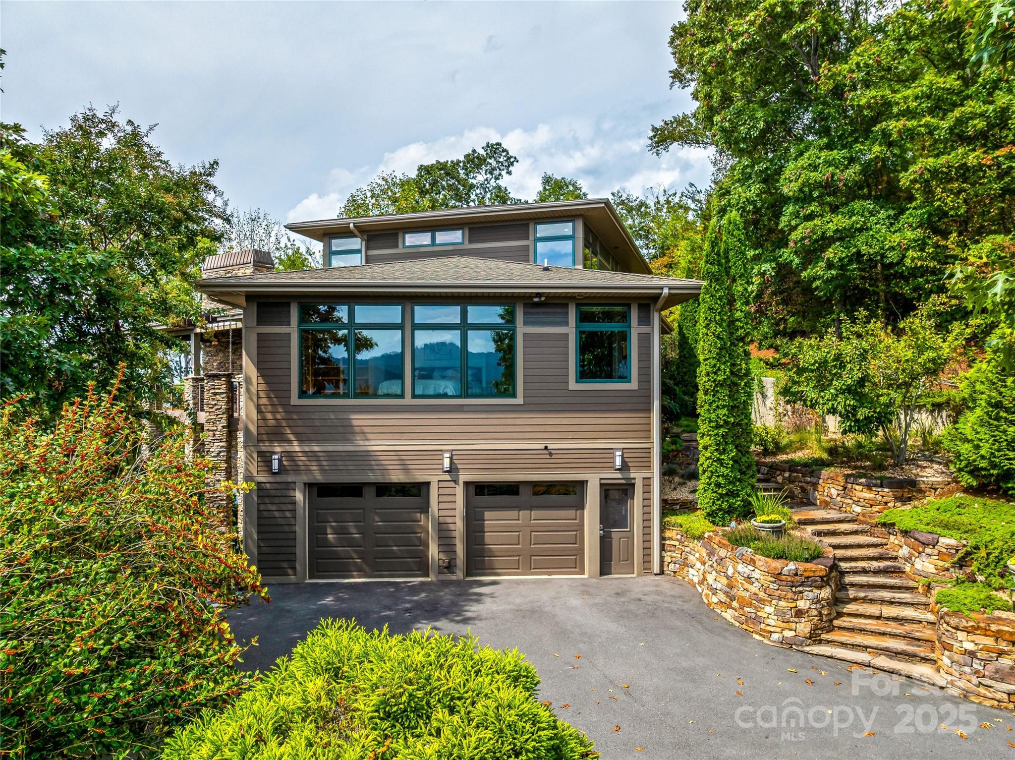 136 Senator Reynolds Road Asheville, NC 28804 - Photo 5 of 48 a front view of a house with a garden