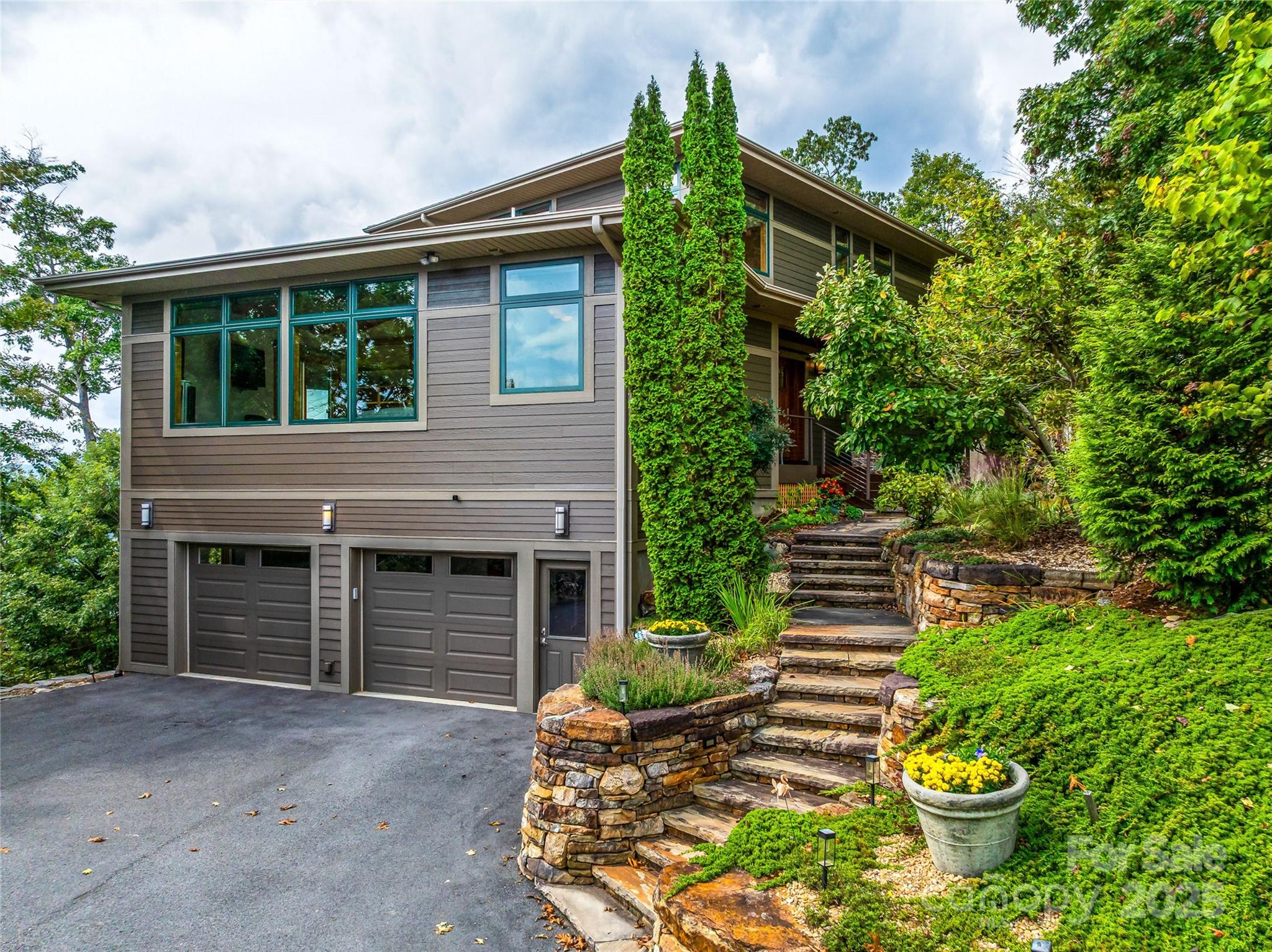 136 Senator Reynolds Road Asheville, NC 28804 - Photo 6 of 48 a front view of a house with garden
