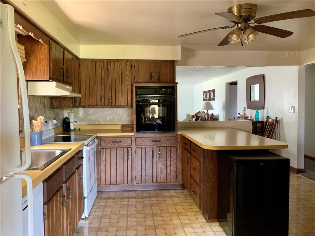 1165 Bonniebrook Road Butler, PA 16002 - Photo 8 of 25 Kitchen with abundant cabinet and counter space. Refrigerator, dishwasher, electric stove, and built-in electric oven included.