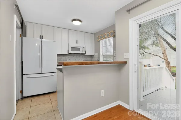 a kitchen with stainless steel appliances a refrigerator sink and cabinets