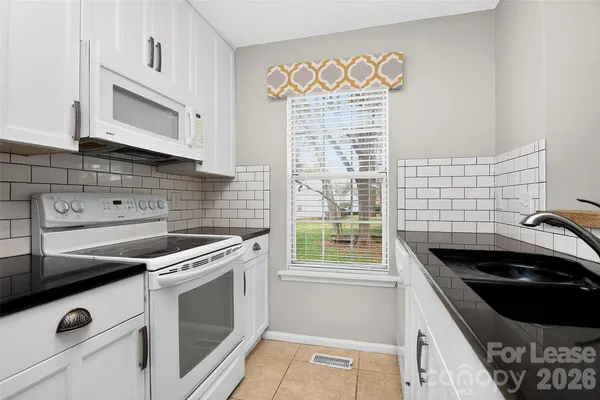 a kitchen with a stove and a sink