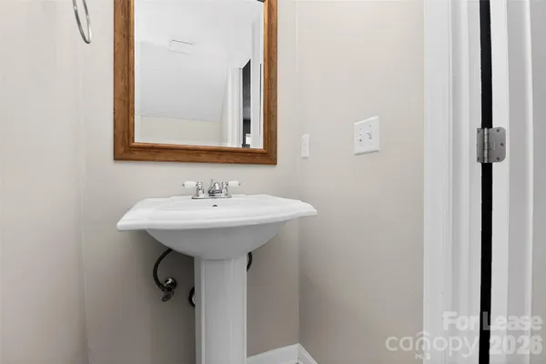 a bathroom with a sink and mirror