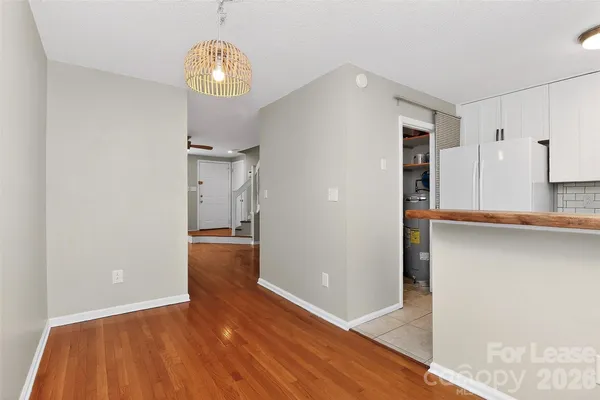 a view of a kitchen cabinets and wooden floor