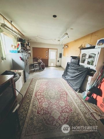 a bed room with a bed and a television