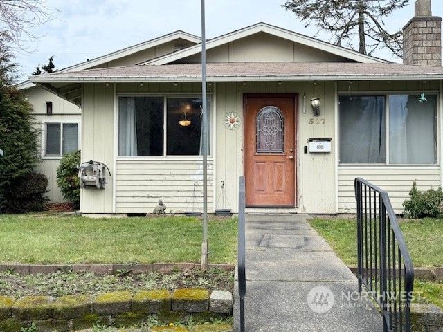 a front view of a house with garden