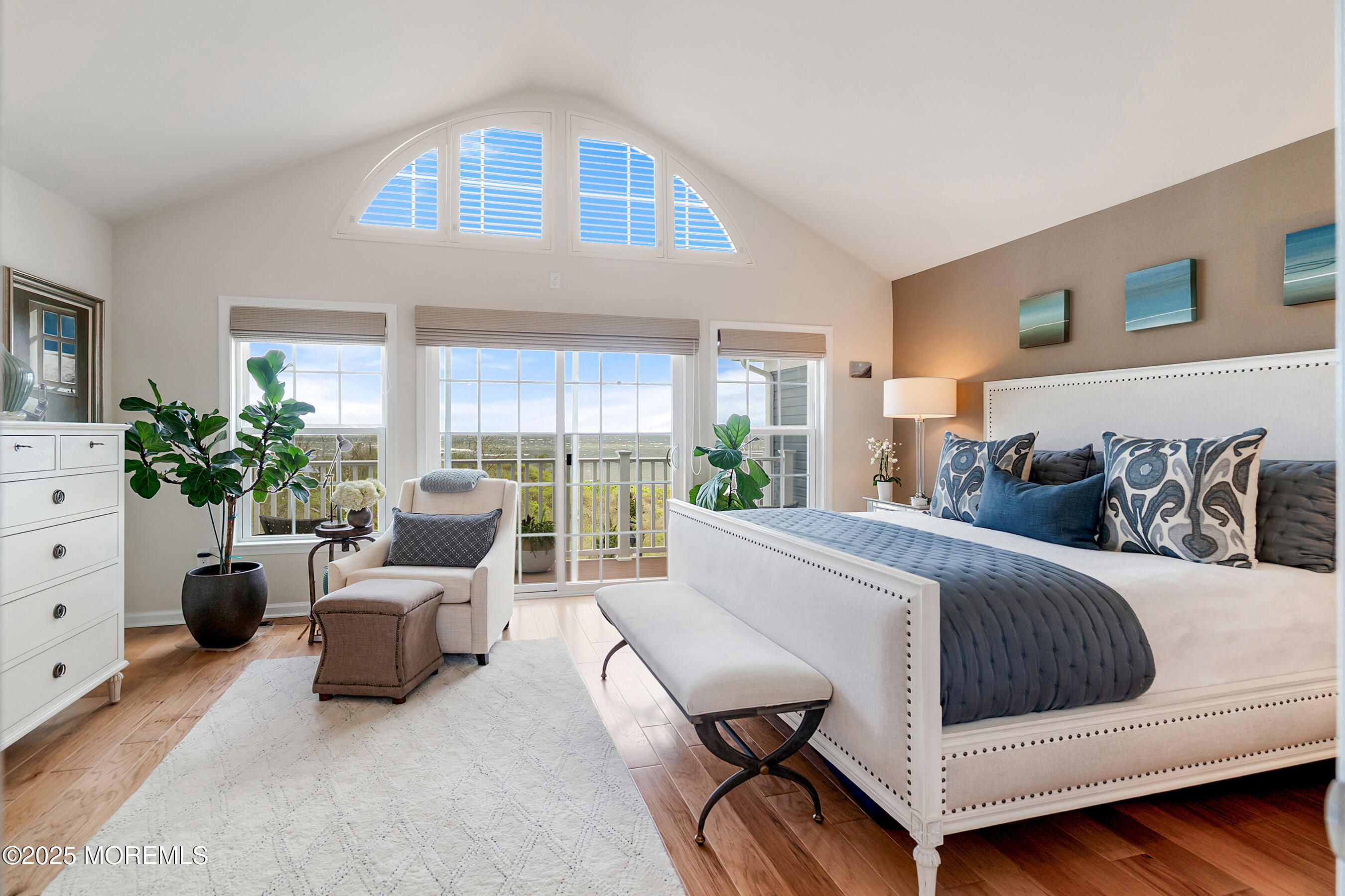 19 Lighthouse Point Road, Unit 504 Highlands, NJ 07732 - Photo 13 of 43 a spacious bedroom with a bed and a couch