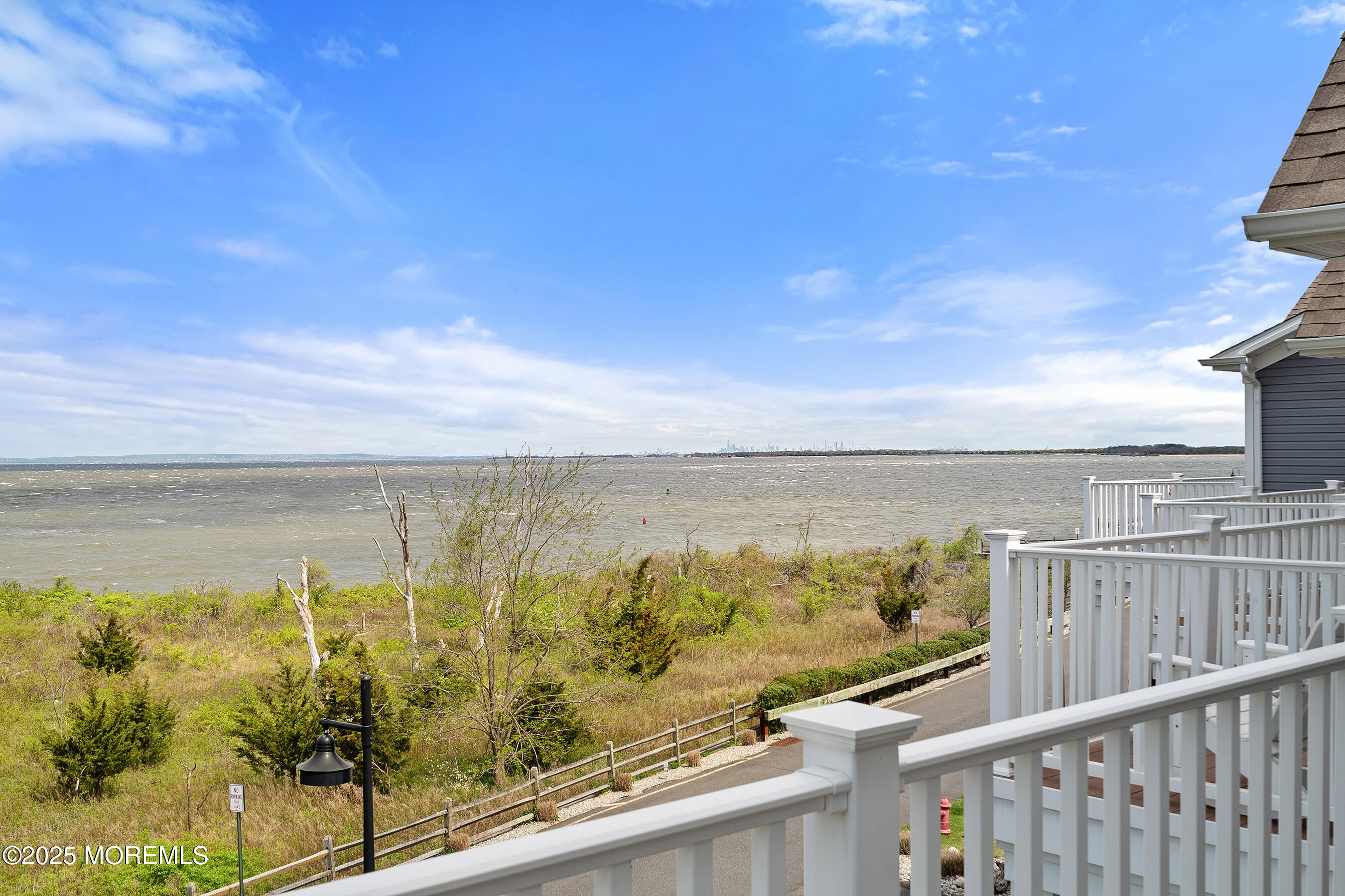 19 Lighthouse Point Road, Unit 504 Highlands, NJ 07732 - Photo 16 of 43 a view of a city from a balcony