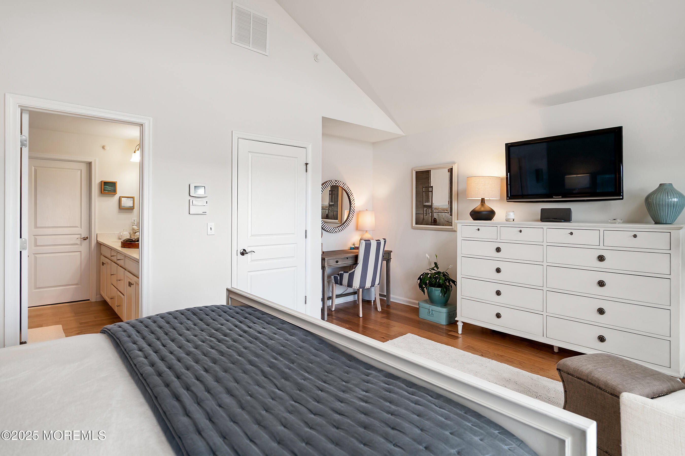 19 Lighthouse Point Road, Unit 504 Highlands, NJ 07732 - Photo 18 of 43 a bedroom with furniture and a flat screen tv