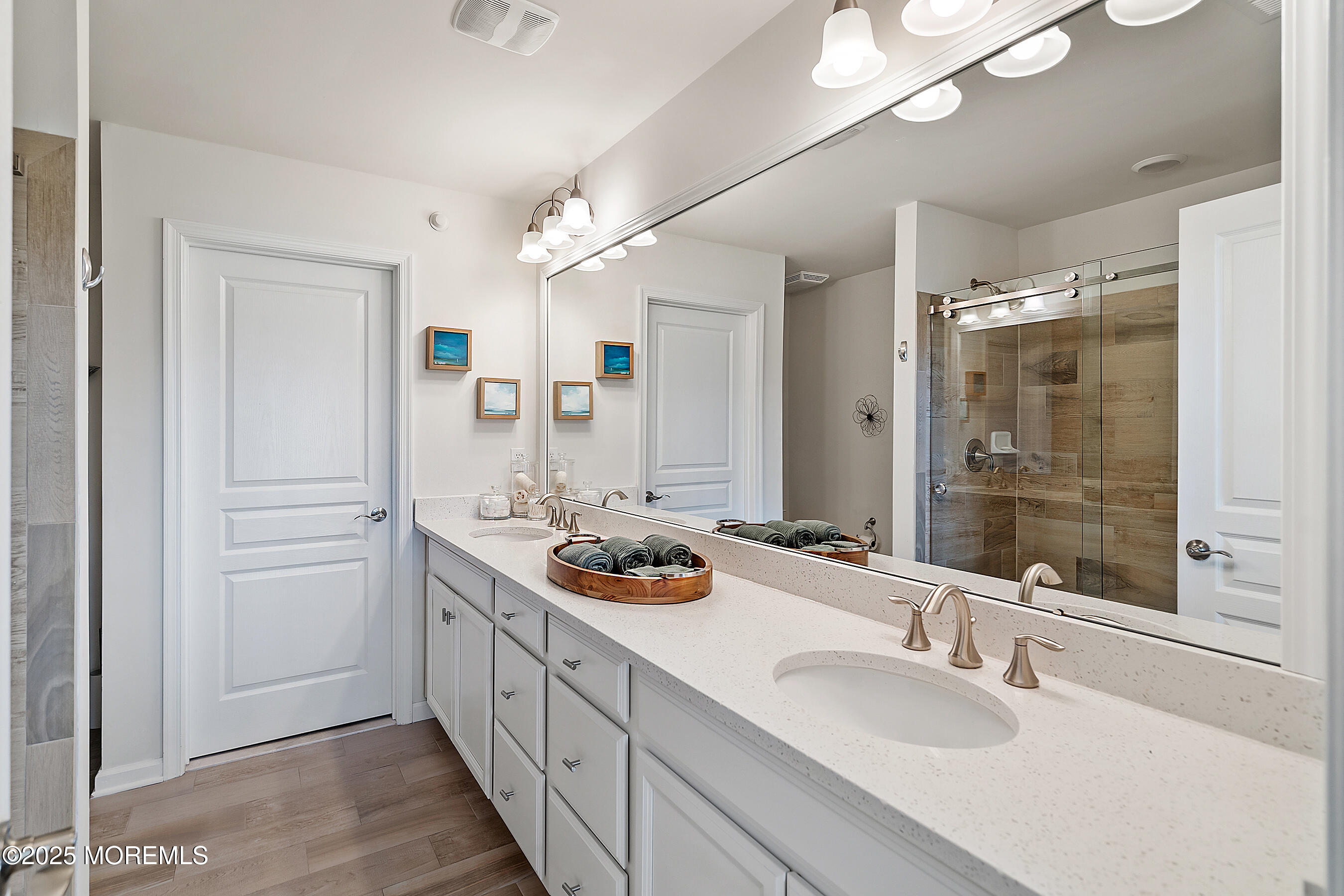 19 Lighthouse Point Road, Unit 504 Highlands, NJ 07732 - Photo 19 of 43 a bathroom with a double vanity sink and mirror