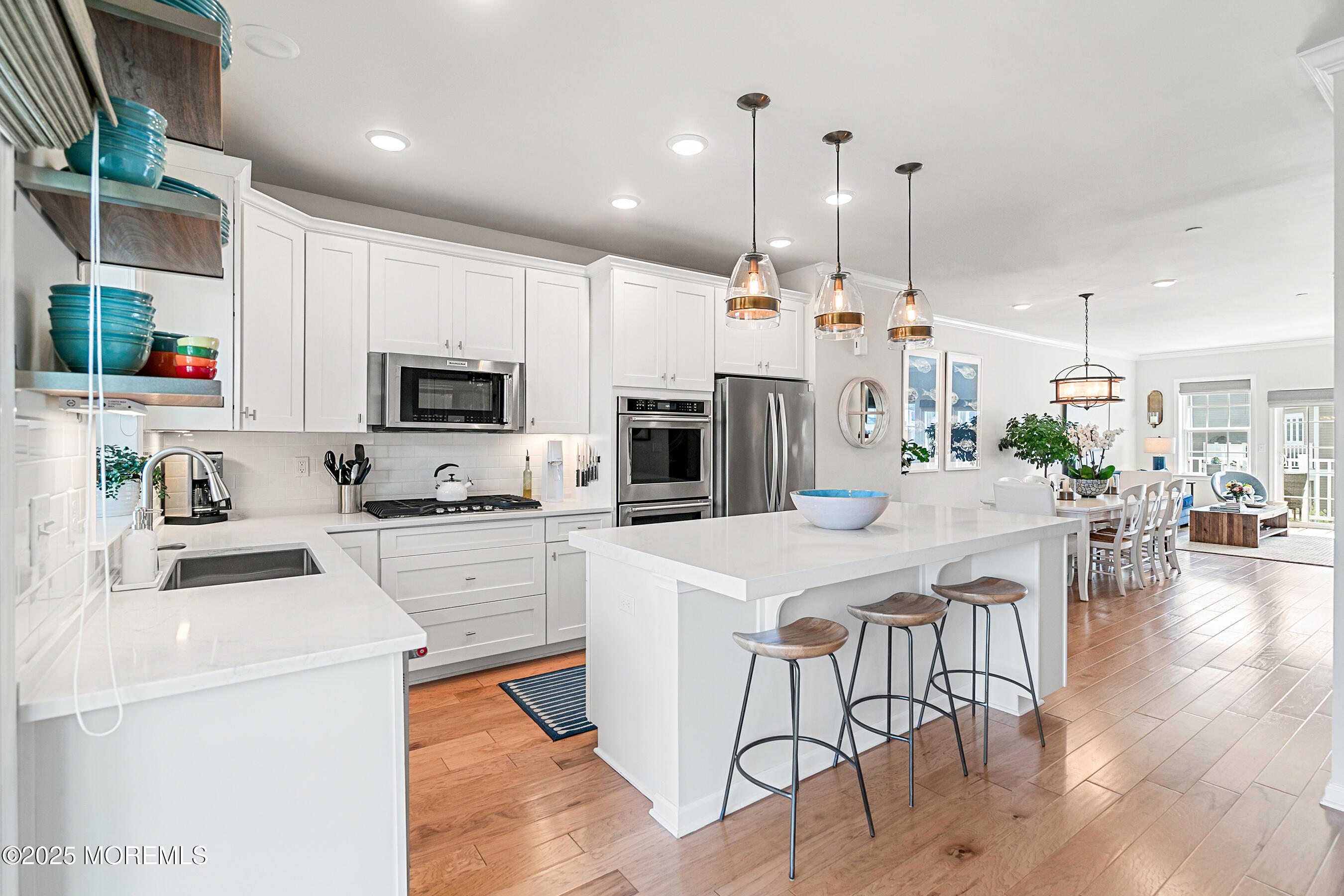 19 Lighthouse Point Road, Unit 504 Highlands, NJ 07732 - Photo 2 of 43 a kitchen with stainless steel appliances a stove a sink a microwave a center island and a refrigerator