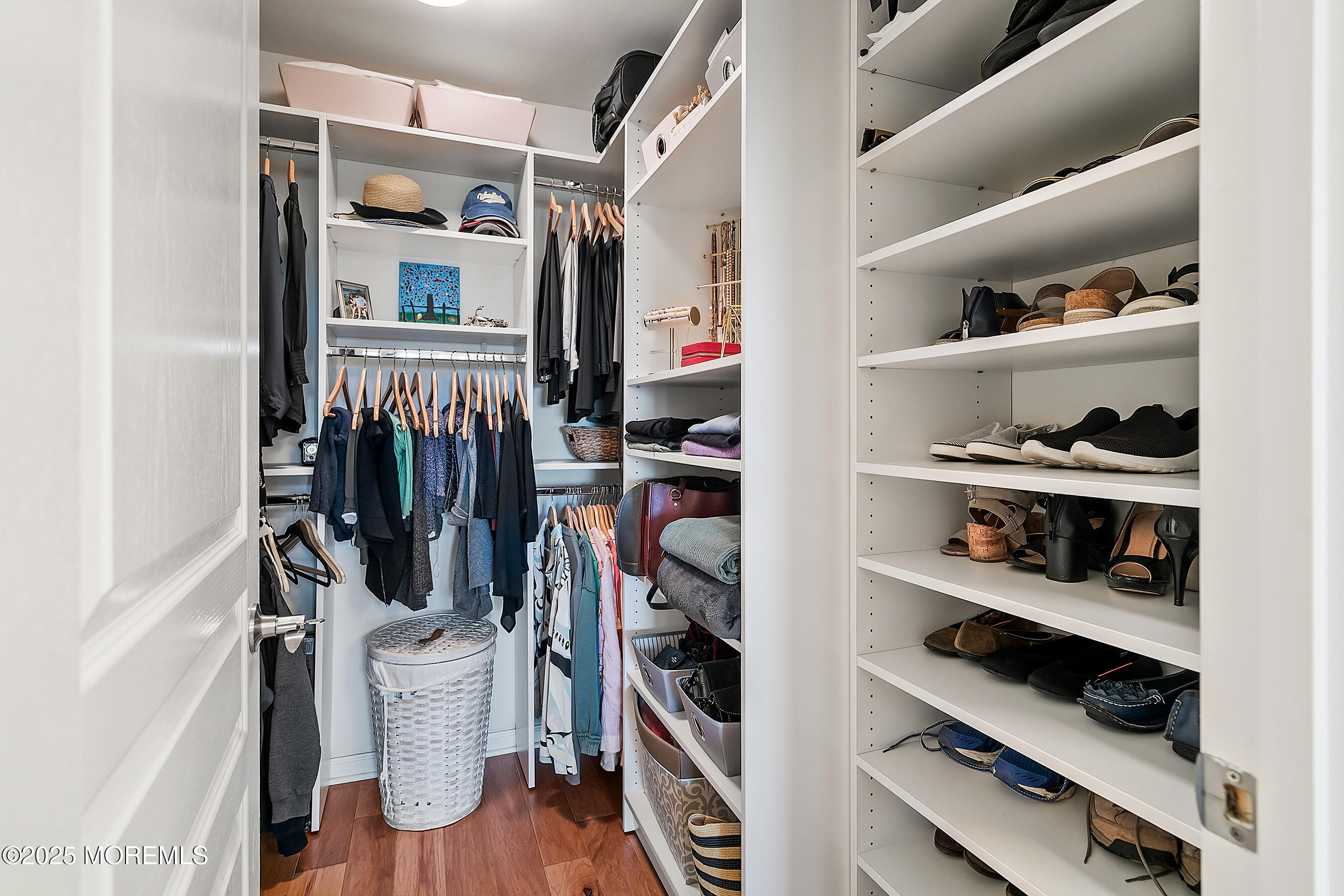 19 Lighthouse Point Road, Unit 504 Highlands, NJ 07732 - Photo 21 of 43 a view of walk in closet with clothes and shoes