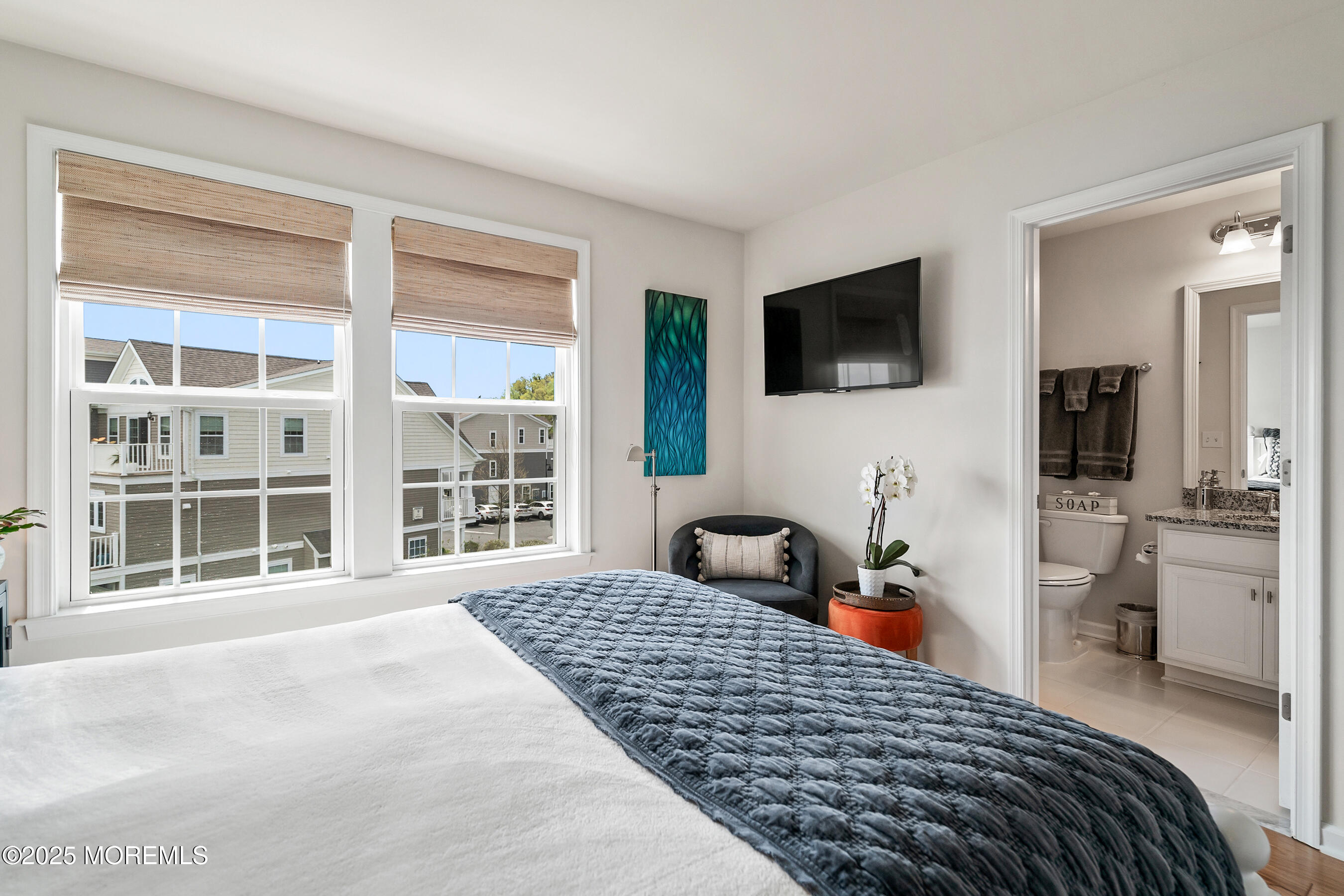 19 Lighthouse Point Road, Unit 504 Highlands, NJ 07732 - Photo 23 of 43 a bedroom with a bed and a flat screen tv