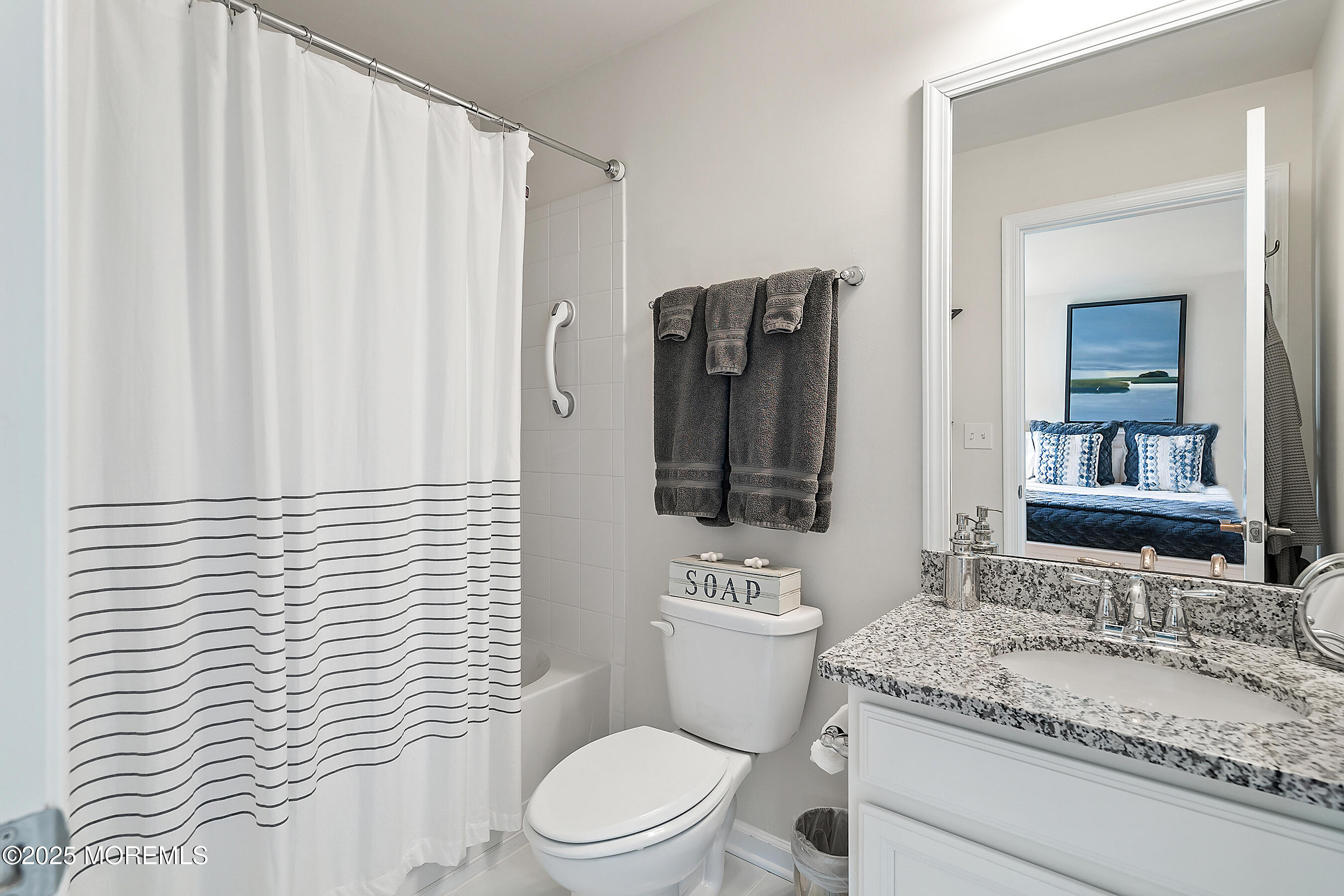 19 Lighthouse Point Road, Unit 504 Highlands, NJ 07732 - Photo 24 of 43 a bathroom with a granite countertop sink toilet and mirror